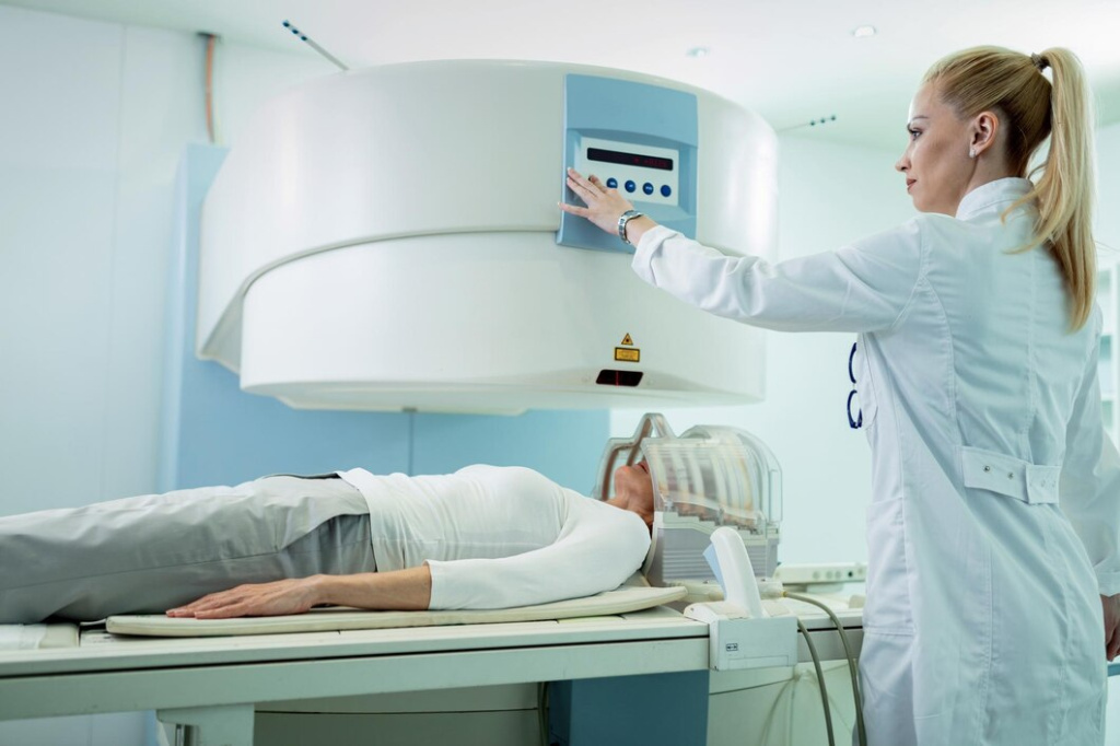 radiologist-adjusting-mri-scanner-before-medical-examination-patient-who-is-getting-brain-scan-hospital_637285-413.jpg